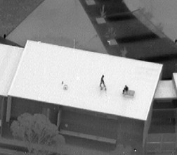 Image of detainees on roof during Banksia Hill riot in Jan 2013
