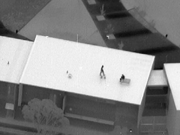 Image of detainees on roof during Banksia Hill riot in Jan 2013
