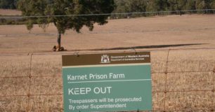 2013 Karnet Prison Farm Inspection view of a sign on the farm fence line