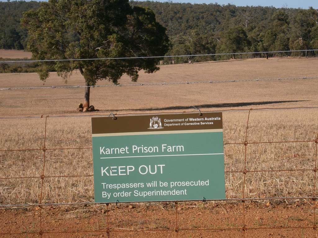 2013 Karnet Prison Farm Inspection view of a sign on the farm fence line
