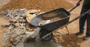 Image of a prisoner using a wheelbarrow at Dowerin Work Camp