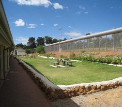 Image of a picnic table inside the perimetre fence at Wooroloo Prison Farm