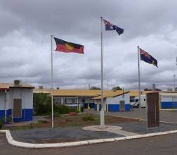 Photo of 3 flags outside prison