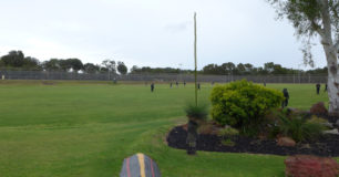 Photo of prisoners on a green grassed oval