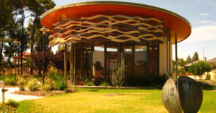 A circular enclosed building, with seating for spiritual meetings for all religions