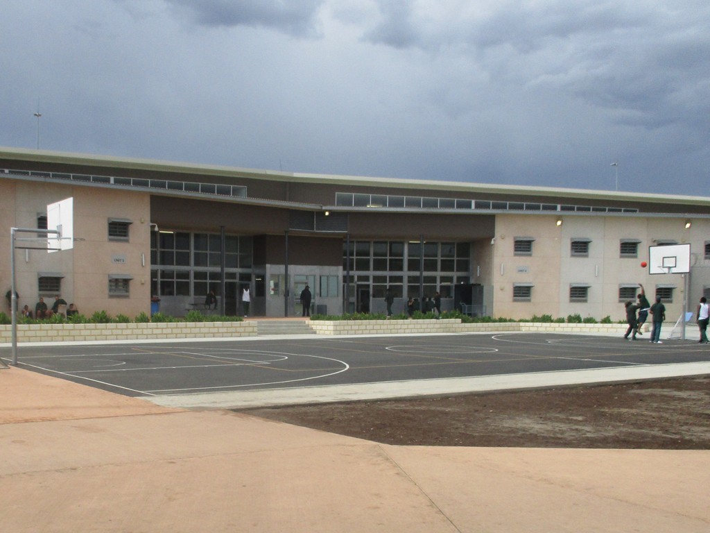 Image of the Young Adults Facility taken from outside with Young Adults playing on a basket ball court