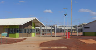 Image of Unit 3, outside entrance with fence and gate.