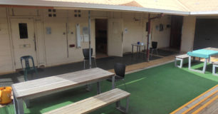Iamage of the female prisoners yard at Broome Regional Prison with seating and tables