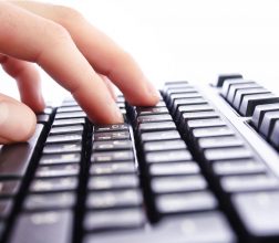 Photo of hands on a keyboard