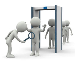 Illustration of people walking through a scan machine and then being searched using a hand held wand