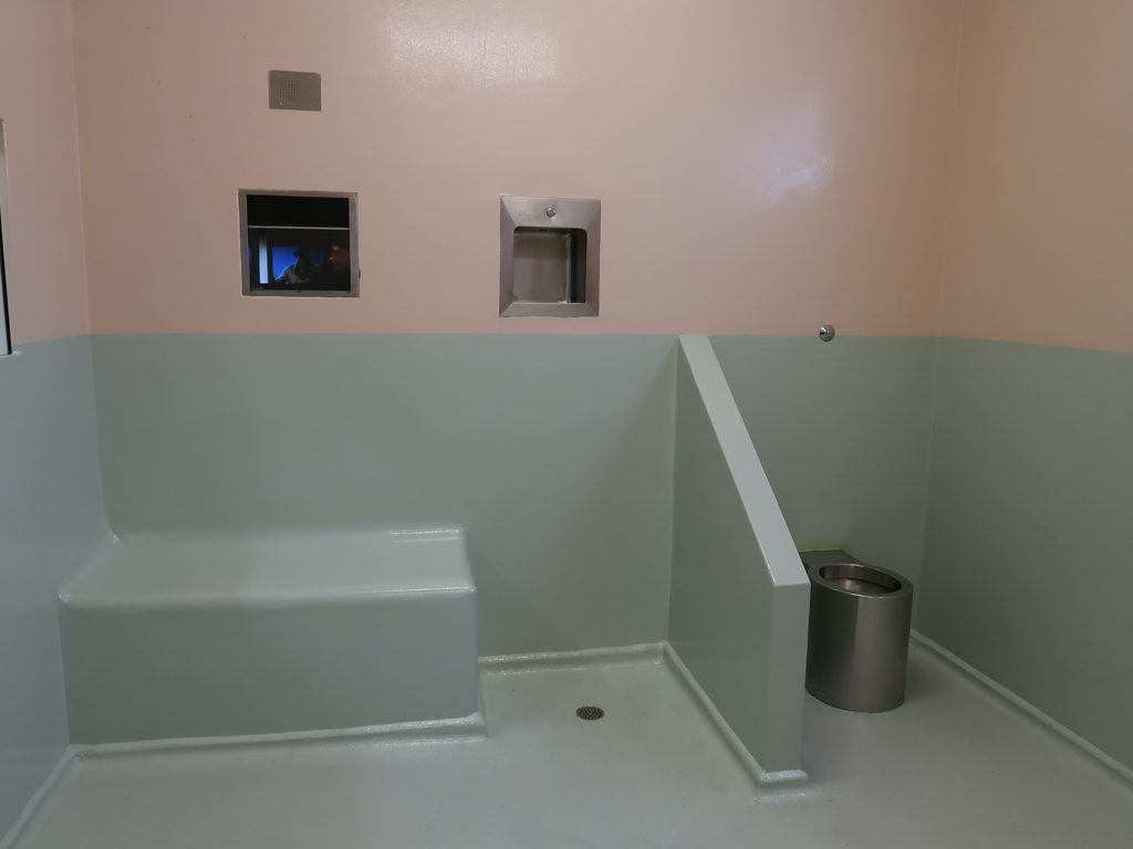 Image of a Seat and toilet in a court custody cell