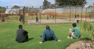 Image of men watching tennis at Casuarina Prison