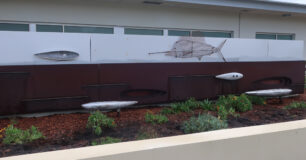 Image of metal artwork at entrance to the PRU at Bunbury Regional Prison