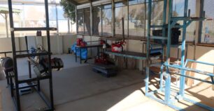 Image of gym at Greenough Regional Prison in Unit 6 with makeshift equipment used as weights.