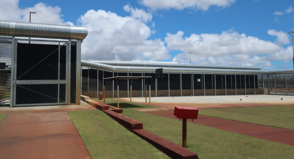 A photo of secure perimeter fence of Unit 18 at Casuarina Prison.