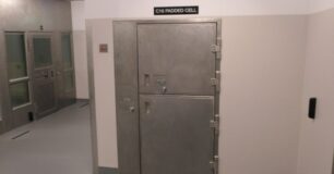 Image of a door to padded cell and holding cells at New Armadale Courthouse