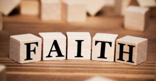 Close up image of the word Faith on wooden blocks