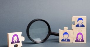 Image of four puzzle pieces, with one puzzle piece to the side representing one staff member missing.